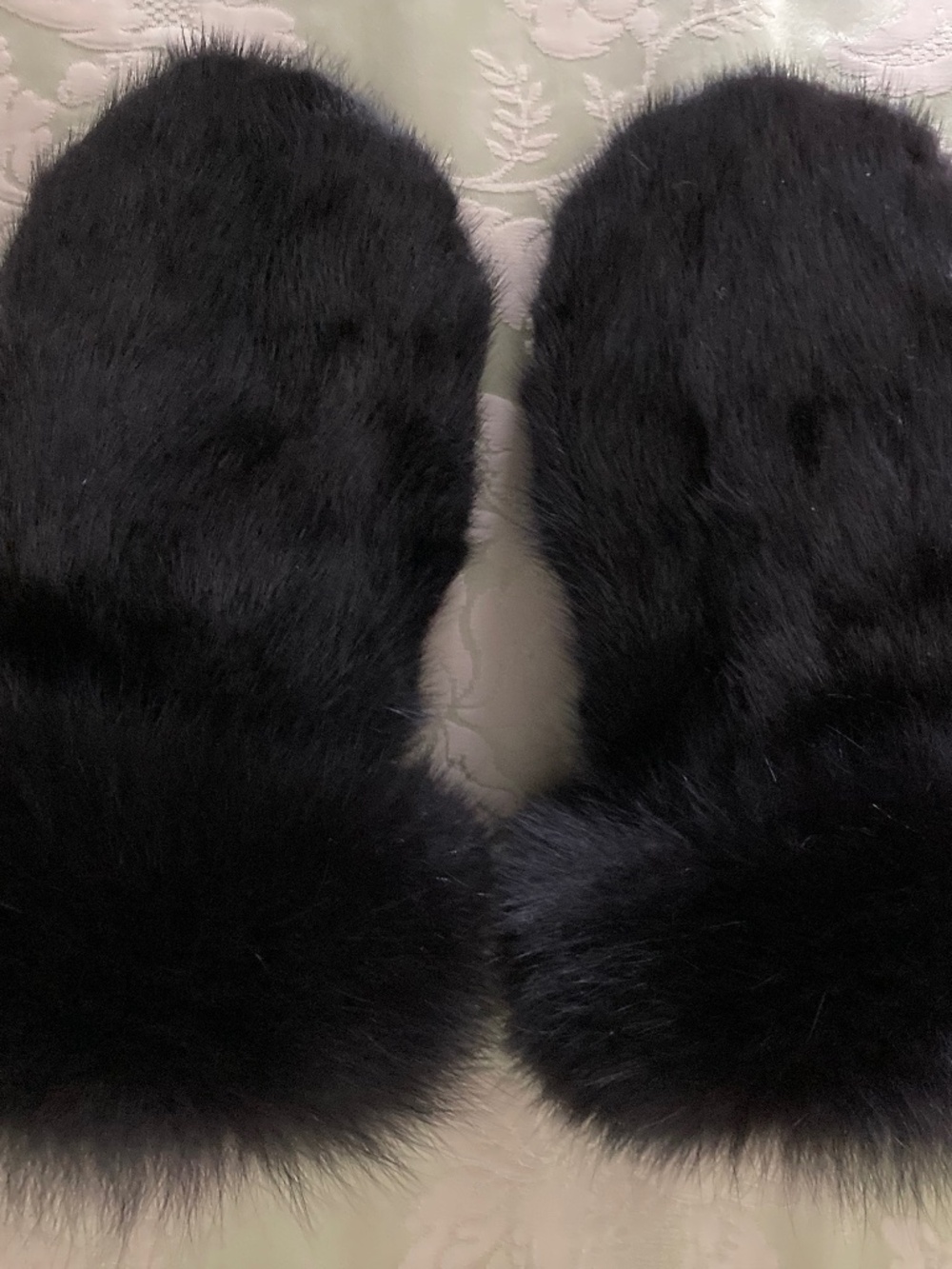 Mittens made from natural black mink and black fox .